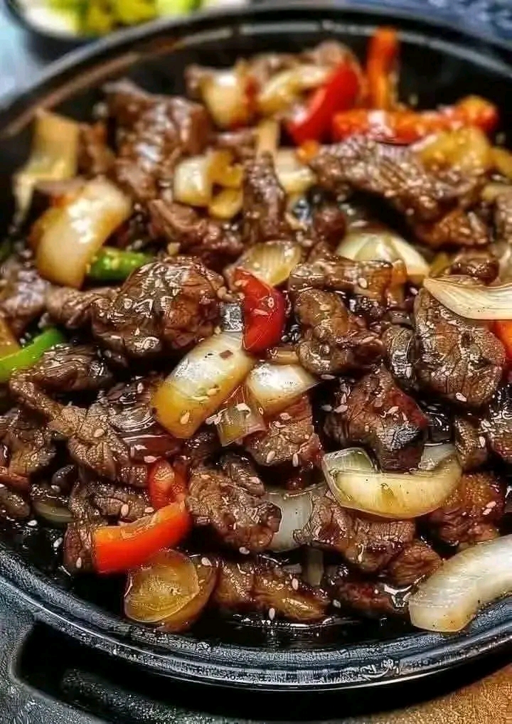Juicy Chinese pepper steak with onions cooked in a rich savory sauce, perfect for a quick dinner.